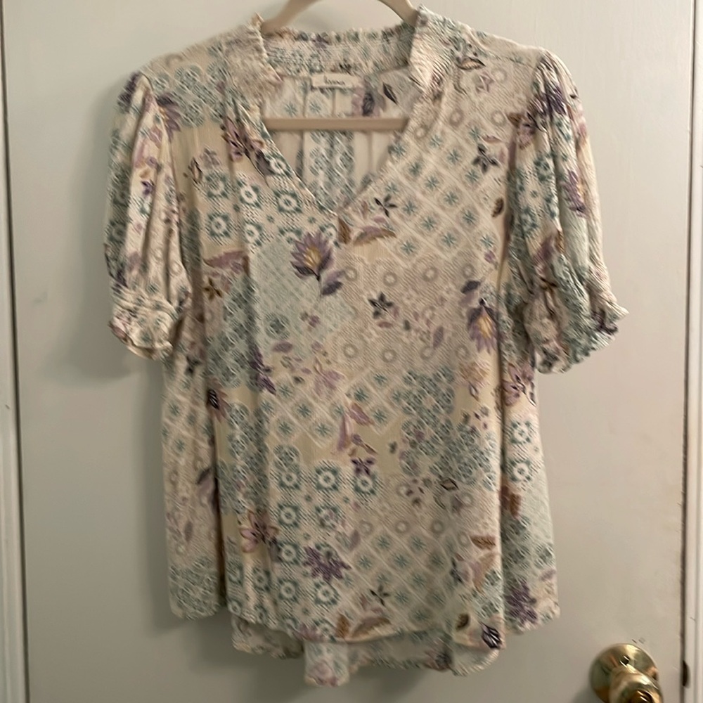 Women’s short sleeve, V neck, lightweight top.